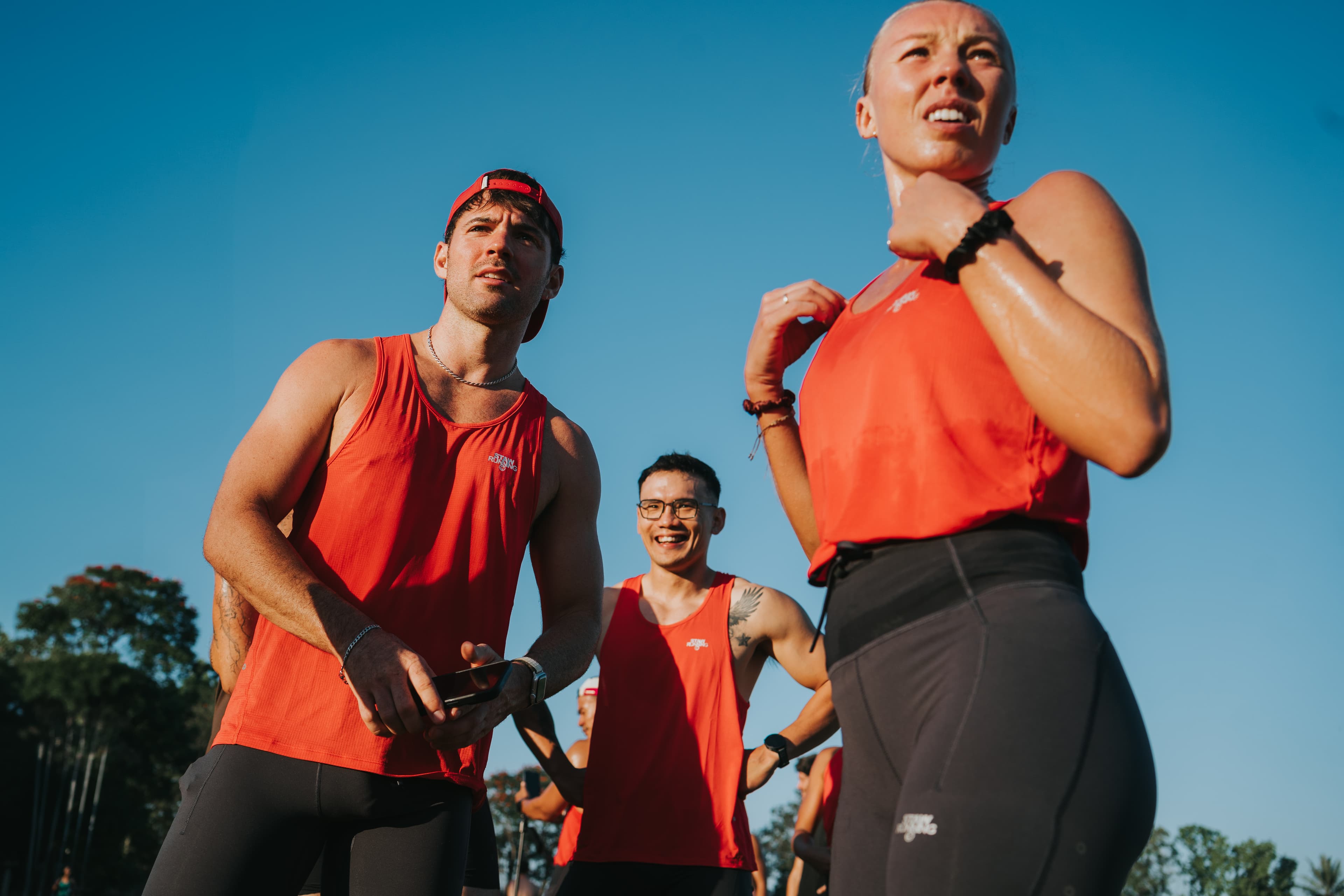Chase Track Club runners in red kits at a Tuesday session.