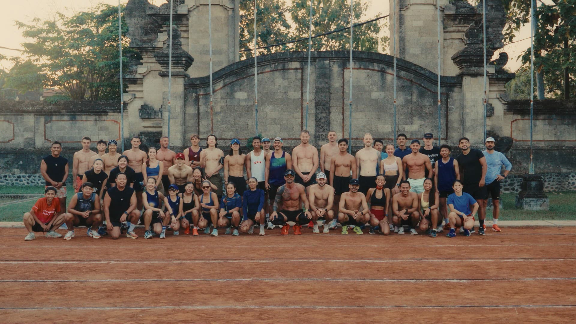 Chase Track Club runners lined up on the track at Lapangan Mengwi.